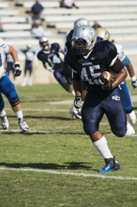 Kristopher Bass, #45, linebacker, running down the field getting El Camino a first down. 