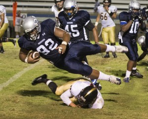 Julian Jackson, #92, Defense Linemen, gets the ball after the opponent team fumbles it.
