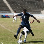 Kyrian Nwabueze, #9, Forward, jumps past the opposing defender to get control of the ball. Kyrian would have 2 goals in the Warriors's 4-1 win over the Compton Center.